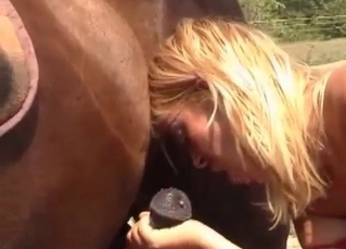 Busty blonde nailed by stallion at the farm